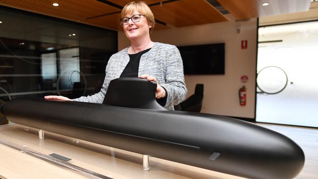 Defence Minister Linda Reynolds poses for a photo next to a model of the Barracuda-class submarine during a visit to Naval Group in Adelaide in February. Picture: AAP