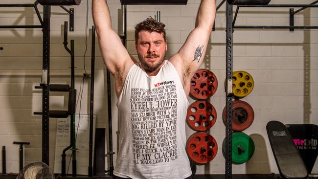 Harry Owen modelling the rare NT News muscle singlet. Picture: Pema Tamang Pakhrin