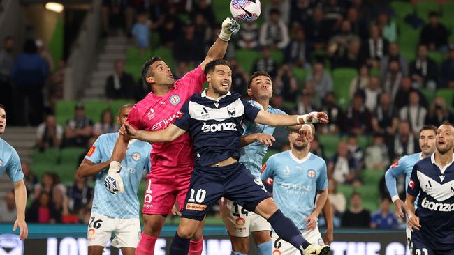 Jamie Young punches the ball away from Bruno Fornaroli.