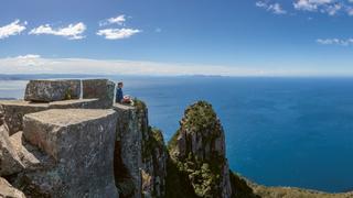 Hiker on the summit of Bishop and Clerk (620m), Maria Island. Picture: Mark Daffey
