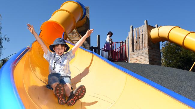 Charlie, 8, slides down one of Bicentennial Park’s giant slides. Picture: Jason Sammon