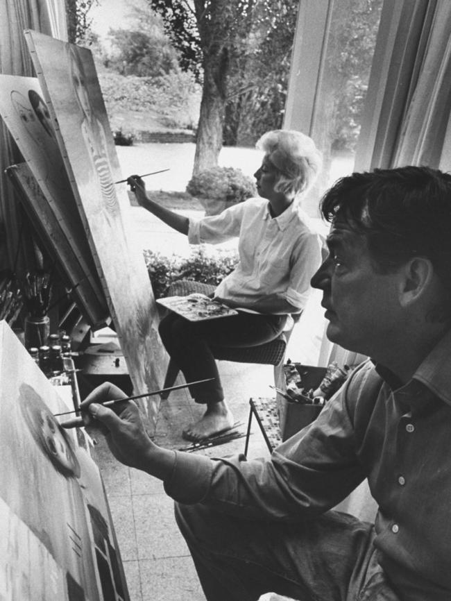 Sinister dealings: Artists Walter and Margaret Keane at work in the studio. Picture: Getty Images