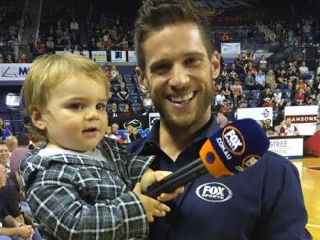 Dan Ewing with son Archie at NBL match in Wollongong