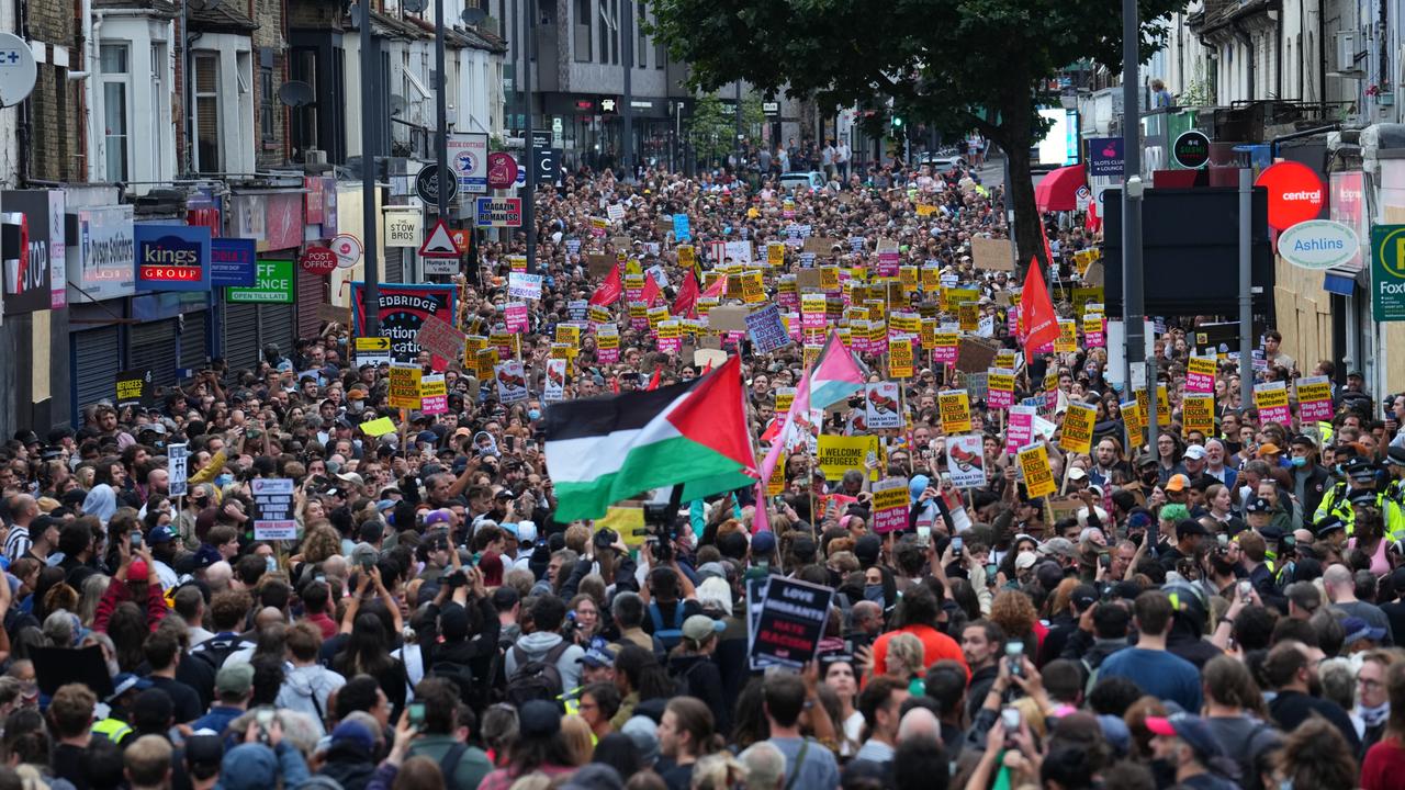 A Palestinian flag is waved as anti-racism counter protesters gathered ahead of a potential anti-immigration protest in Walthamstow, United Kingdom. Picture: Carl Court/Getty Images