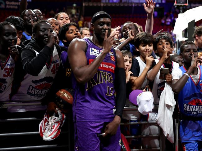 Kouat Noi celebrates with fans following the Sydney Kings’ win over champions Tasmania JackJumpers. Photo: Brendon Thorne/Getty Images.