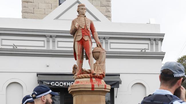 Police at the Captain Cook statue after the vandalism.