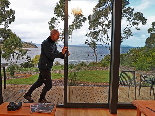 Spring Bay Mill general manager Robert Williams shows of one of the shacks at the site people can book. Picture: ZAK SIMMONDS