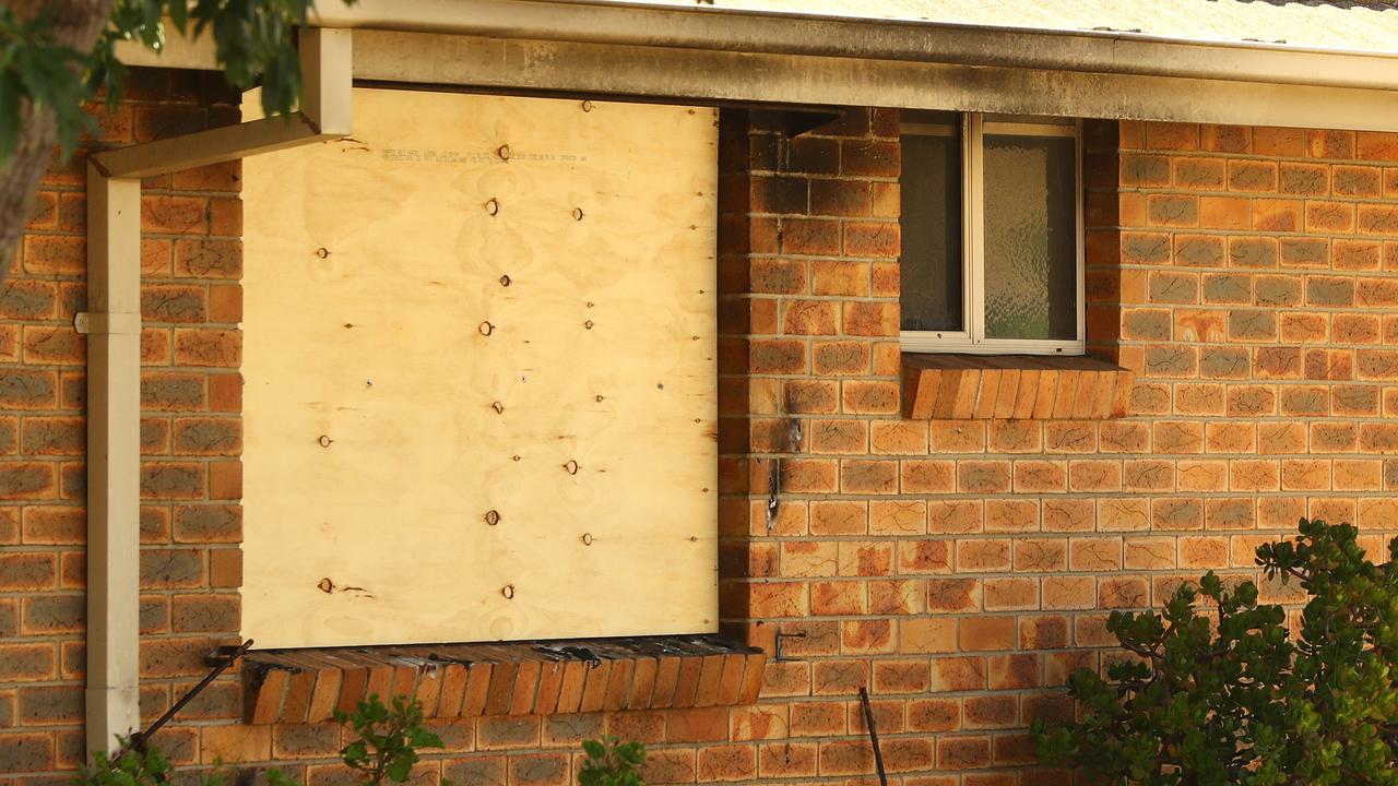 A fire damaged window at the scene. Picture: Alison Wynd