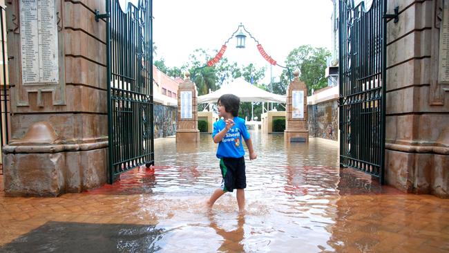 Kaydin Vonschoeler in the first flood water to enter through the Memorial Gates, 2011. Craig Warhurst The Gympie Times