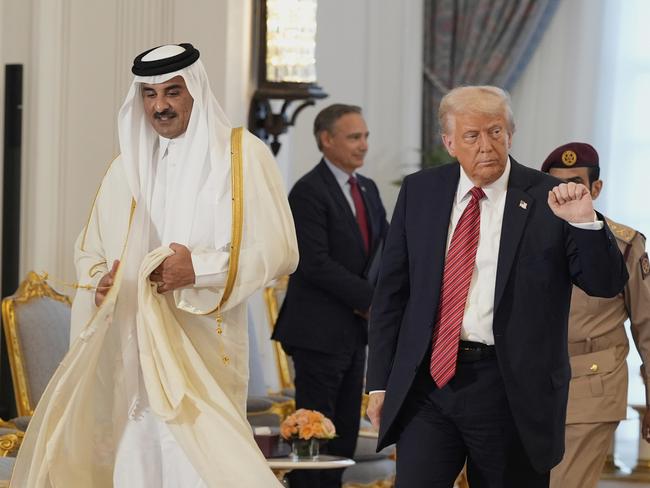 President Donald Trump walks with Qatar's Emir Sheikh Tamim bin Hamad Al Thani after a signing ceremony at the Amiri Diwan in Doha, Qatar, Wednesday, May 14, 2025. Picture: AP Photo/Alex Brandon