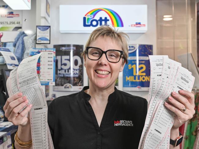 Kylie Brown in her Glenelg newsagency with Powerball syndicate entries, which have been popular among customers. Picture: NCA NewsWire / Brenton Edwards