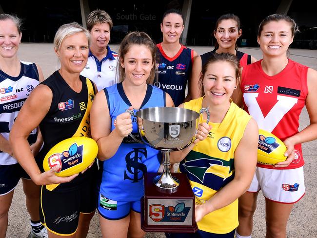 L-R Captains  South Adelaide - Lauren Buchanan ,Glenelg -  Cass Hartley , Centrals Assistant coach Natalie Seaman, Sturt Georgia Bevan, Norwood Leah Cutting,Eagles Adele Gibson, West Adelaide Lauren Rodato and North Adelaide Nadia Von Bertouch pose out the front of Adelaide Oval during the SANFLW launch  today Monday February 11,2019.(Image AAP/Mark Brake)