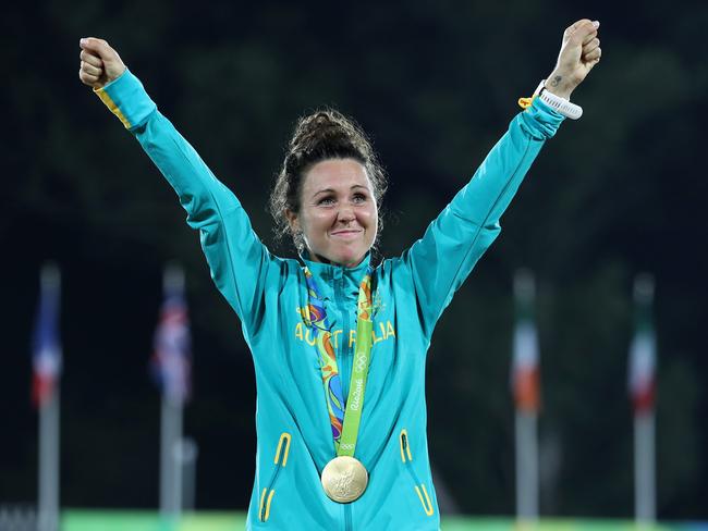 Chloe Esposito poses on the podium with her gold medal after winning the modern pentathlon.