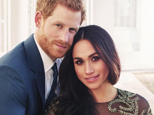 In this photo released by Kensington Palace on Thursday, Dec. 21, 2017, Britain's Prince Harry and Meghan Markle pose for one of two official engagement photos, at Frogmore House, in Windsor, England. (Alexi Lubomirski via AP)