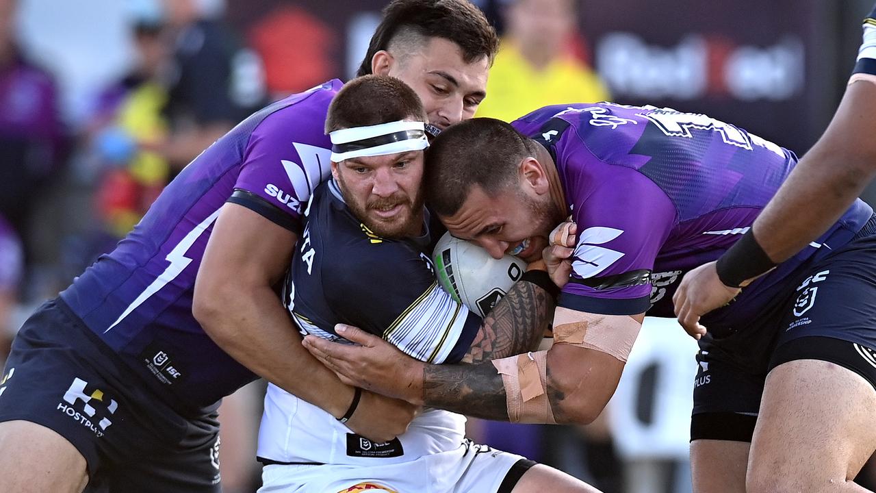 Josh McGuire is tackled by the Storm
