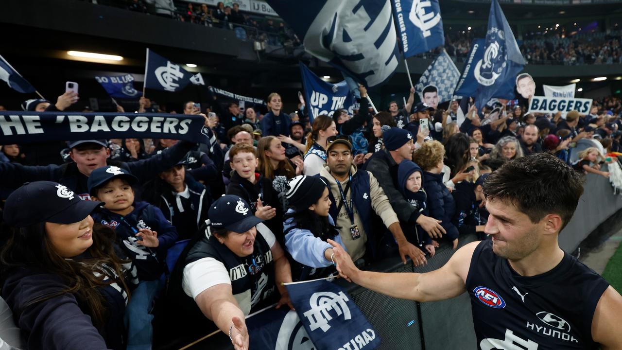 MELBOURNE, AUSTRALIA - APRIL 20: Nic Newman of the Blues celebrates with fans during the 2024 AFL Round 06 match between the Carlton Blues and the GWS GIANTS at Marvel Stadium on April 20, 2024 in Melbourne, Australia. (Photo by Michael Willson/AFL Photos via Getty Images)