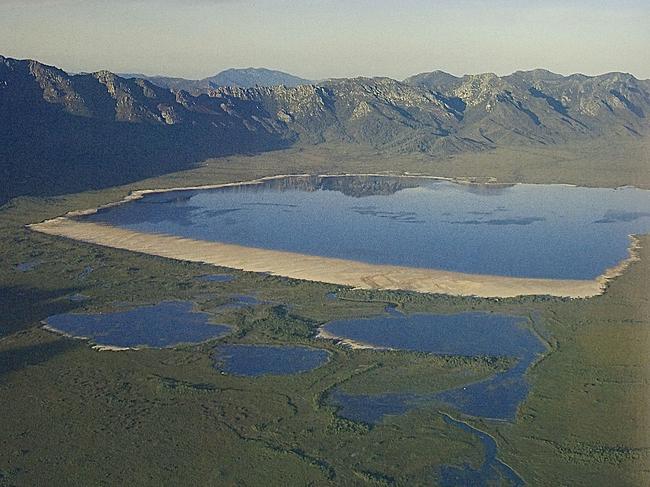 The original Lake Pedder, including its unique 3km long, almost 1km wide pink quartzite beach, which now sits under 15 metres of water. The lake was flooded for a hydro-electric scheme in 1972 but there is an ongoing campaign to restore the lake to its original level - and bring the amazing beach back to life. Picture: Elspeth Vaughan