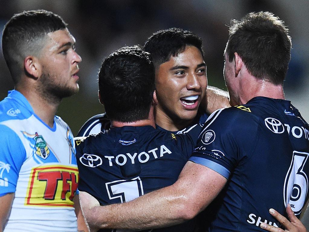 North Queensland Cowboys v Gold Coast Titans from 1300 Smiles Stadium, Townsville.  Cowboys Jason Taumalolo celebrates his try with team mates Lachlan Coote and Michael Morgan as Titans Ash Taylor looks on.  Picture: Zak Simmonds