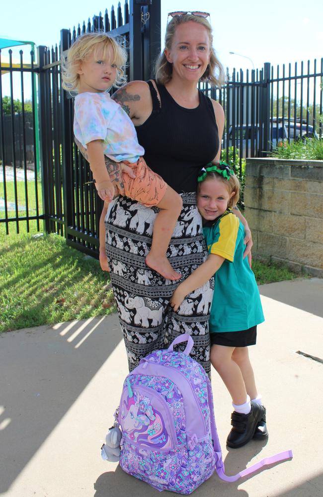 Mikayla Michel clung close to her mum Lisa as she arrived for her first day of school at Moore Park Beach State School together with brother Maxwell.