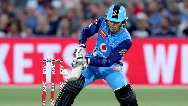 Alex Carey attempts a reverse sweep in the Strikers win over the Scorchers on Monday. Picture: AAP Image/James Elsby