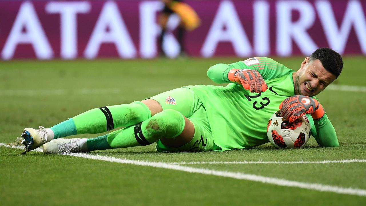 Croatia's goalkeeper Danijel Subasic reacts in pain