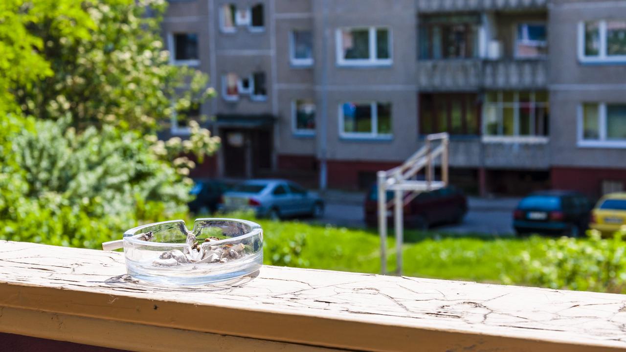 An ashtray on a balcony.