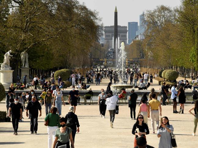 Paris’ Tuileries garden is packed with people as Emmanuel Macron threatens another shutdown. Picture: AFP