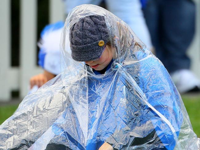 One member of the crowd prepares for the cold weather