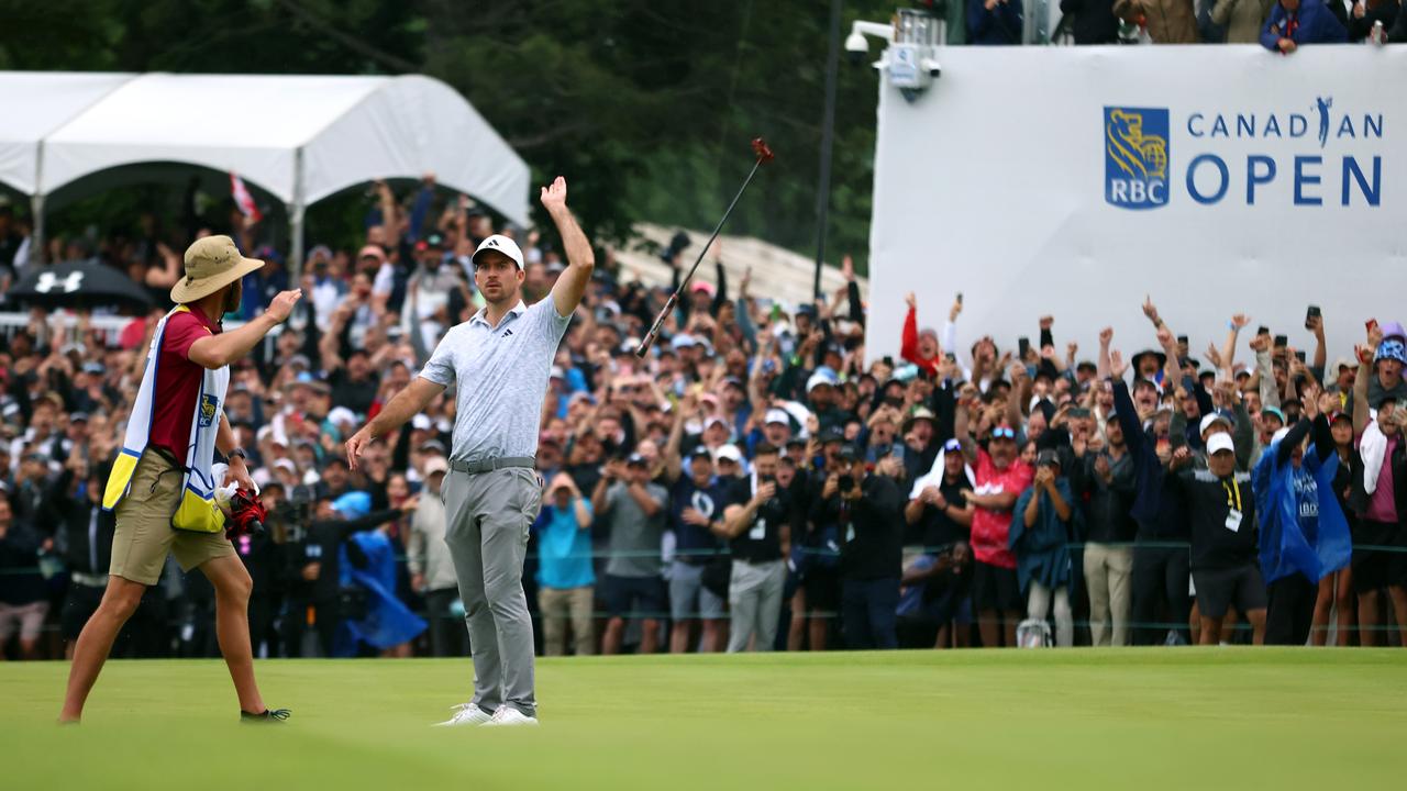 Nick Taylor tosses his club in celebration after making an eagle putt on the 4th playoff hole to win the RBC Canadian Open.. (Photo by Vaughn Ridley/Getty Images)