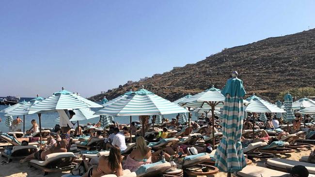 Tourists battle for space on the beach at Psarou Bay on Mykonos. Picture: Contributed