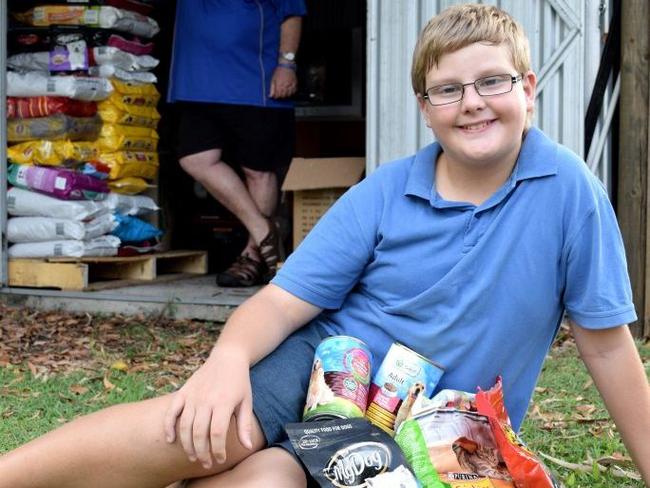 Emmett Withers speaks up to raise food donations for pets in need through his charity Emmett 4 Animals Christmas Pet Food Collection 2015, with the support of Lions Club of Mackay Northern Beaches Seaview Doug Petersen. . Picture: Louise Starkey