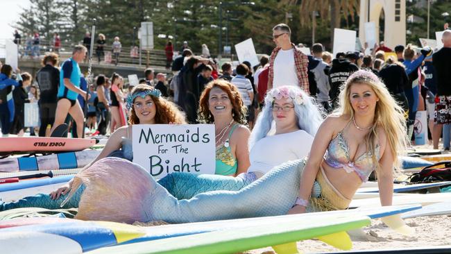 Mermaids Jade, Nicola, Alyssa and Carrie participate in the protest at Brighton beach. Picture: AAP/Emma Brasier