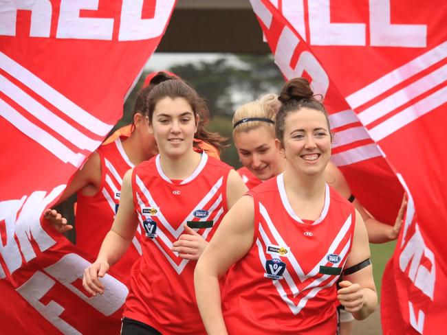 Red Hill players run onto the field last season. Picture: Liz Harris