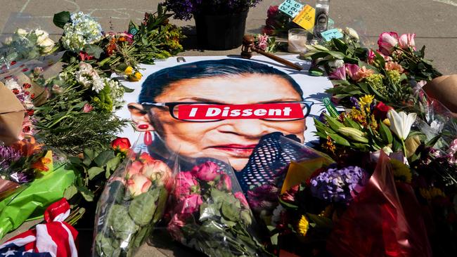 A banner with flowers placed outside the US Supreme Court in Washington, DC on Saturday. Picture: AFP