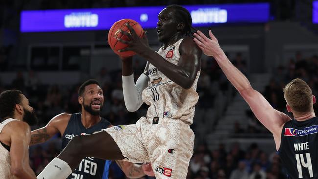 Akoldah Gak of the Taipans rebounds the ball during the round three NBL match between Melbourne United and Cairns Taipans at John Cain Arena. Photo by Daniel Pockett/Getty Images)