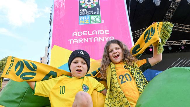 Young Matildas fans seven-year-old Myles Deer and his nine-year-old sister Sadie from Craigburn Farm at the FIFA Fan Zone at the Festival Plaza. Picture: Brenton Edwards