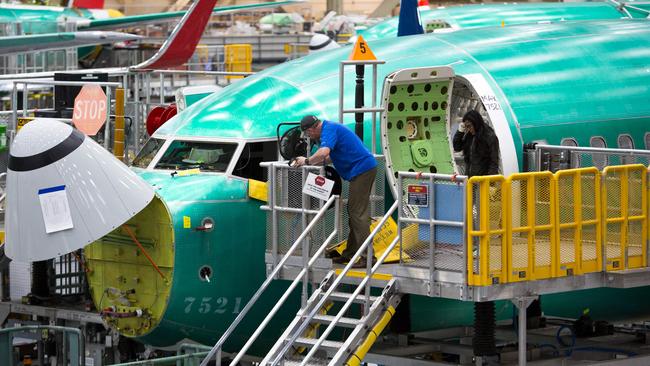 Employees work on Boeing 737 MAX airplanes at the factory in Renton, Washington. Picture: AFP