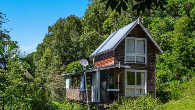 Hidden away, this one-bedroom home is described as "rustic".