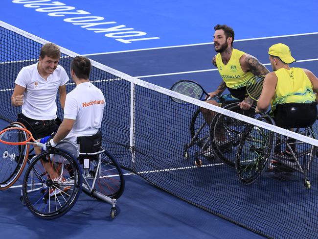 Sam Schroder (R) and Niels Vink of the Netherlands celebrate winning the gold medal against Australia’s Dylan Alcott and Heath Davidson. Picture: Getty Images