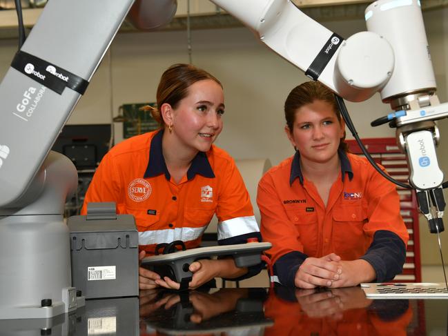 Premier Steven Miles at the opening of the new Robotics and Advanced Engineering facility and the new hydrogen and Renewable Energy facility at the Bohle Tafe in Townsville. Tafe student Nicola Dowd and TECNQ student Bronwyn Douglas at the new robotics centre. Picture: Evan Morgan