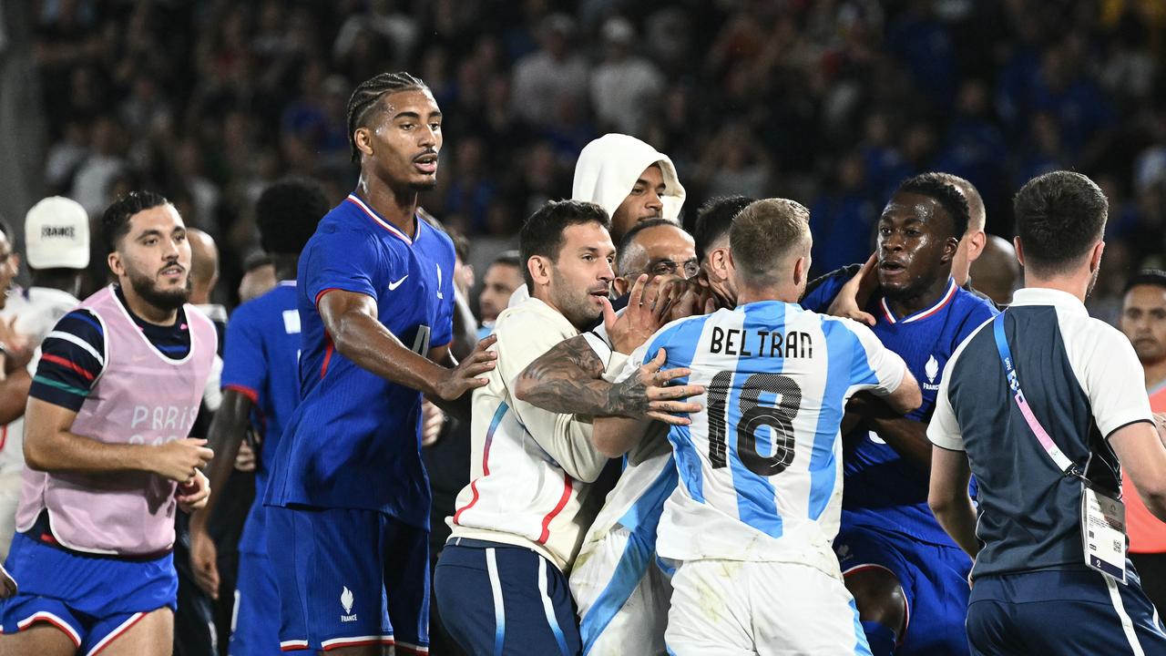 France and Argentina teams react at the end of the match after France won the men's quarter-final football match between France and Argentina during the Paris 2024 Olympic Games at the Bordeaux Stadium in Bordeaux on August 2, 2024. (Photo by Philippe LOPEZ / AFP)