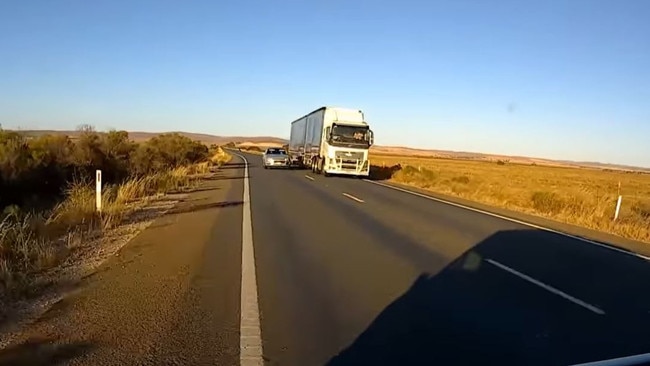 South Australian man Jay Quinn shared footage of his near miss on the Sturt Highway, nearly colliding with a silver station wagon attempting to overtake a truck. Picture: Facebook