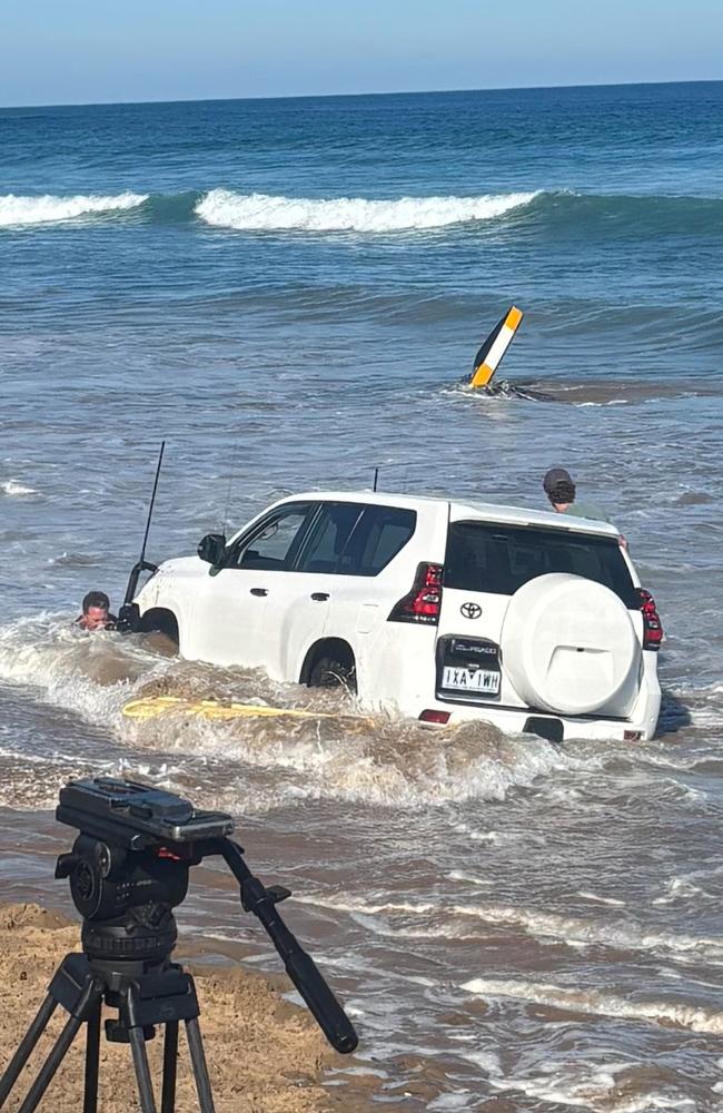 A CFA vehicle became stuck when the tide came up during a chopper rescue operation at Point Lonsdale. Picture: Lucy Crock