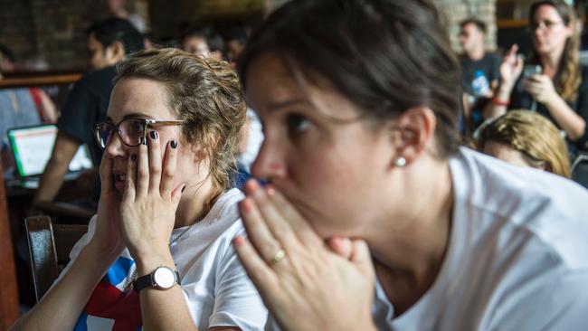 A crowd of American supporters of Hillary Clinton react while watching a live broadcast of the US presidential election. Picture: AFP/ROMEO GACAD