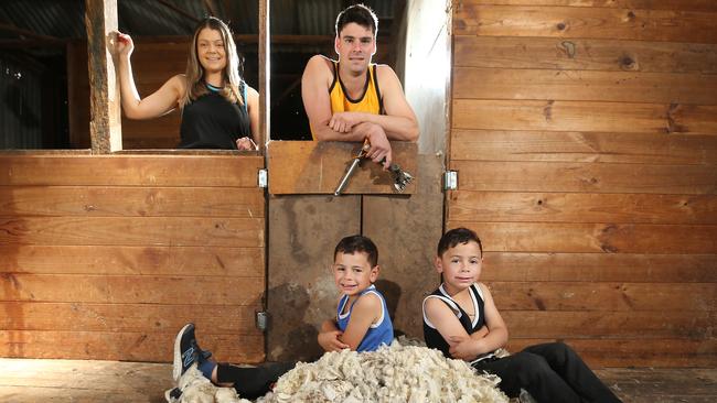 Euroa shearer Tom Birch, with his twins Arlo and Ryder, and his sister Georgia Birch organised a speed shearing event to raise funds for Beyond Blue. Picture: Yuri Kouzmin