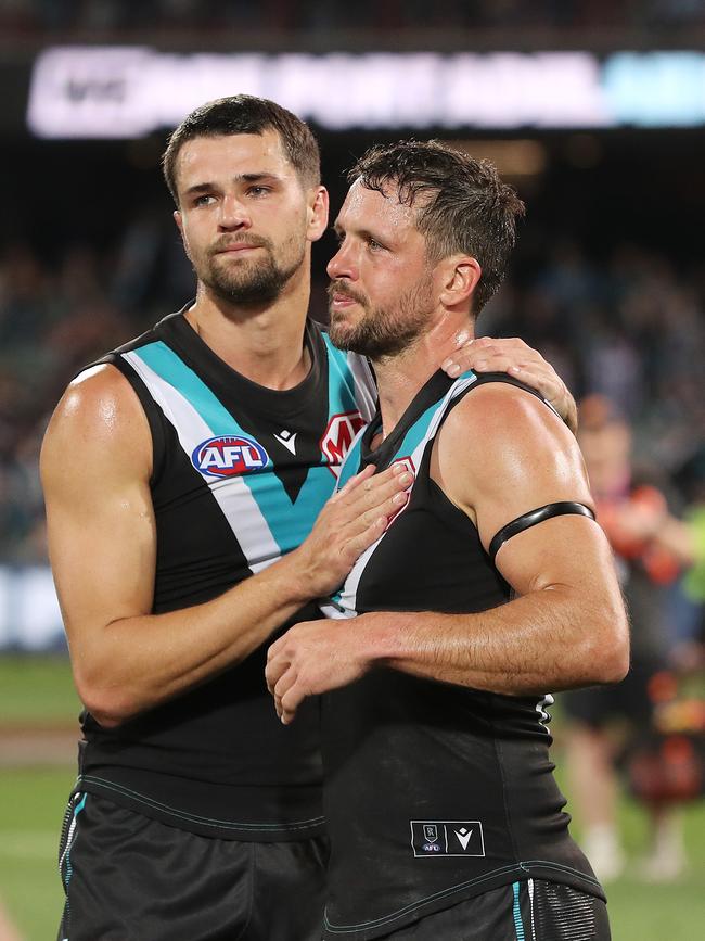 Boak with teammate Ryan Burton after Saturday’s loss. Picture: Sarah Reed/AFL Photos