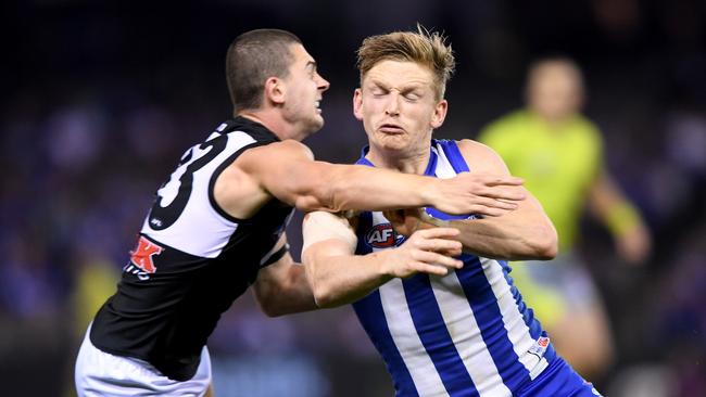 Darcy Byrne-Jones tackles Kangaroos star Jack Ziebell in Round 6. Picture: AAP Image/Joe Castro