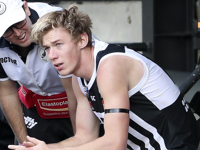 SANFL - Second Semi-Final - Glenelg v Port Adelaide, at Adelaide Oval. Todd Marshall in the hands of Doctors and trainers after getting a knock to the head Picture SARAH REED