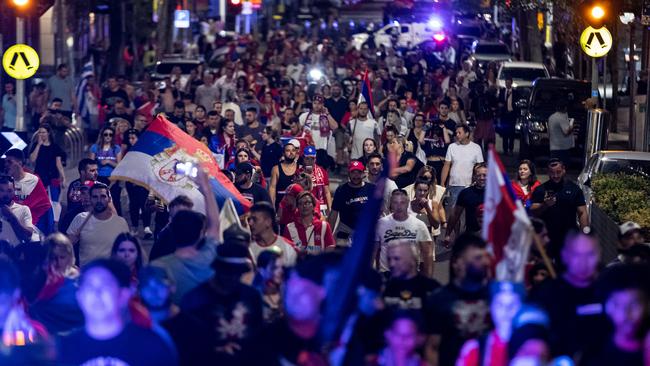 Furious Serbian tennis fans march along Collins St during the Novak Djokovic visa saga. Picture: Getty Images