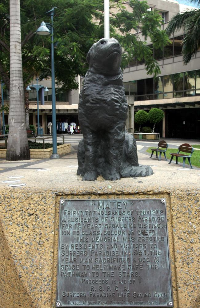 Polly Mitchell with the statue of Matey the dog at Cavill Park in Surfers Paradise. Matey would walk local drinkers home from Jim Cavill's hotel in the 1940s.
